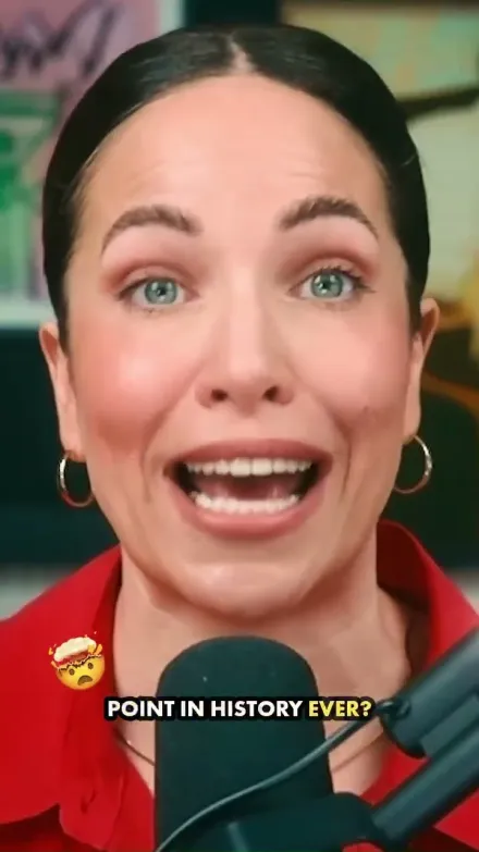 Alex Cattoni short-form post: a woman in a red shirt speaking energetically into a studio microphone.