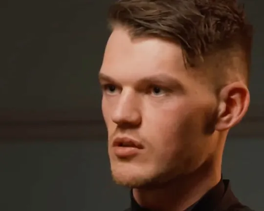 Ben Francis short-form post: a young man in a black top sitting at a podcast microphone.