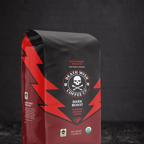 Death Wish Coffee short-form post: a black coffee bag with red lightning bolts and a skull logo on a dark textured surface.