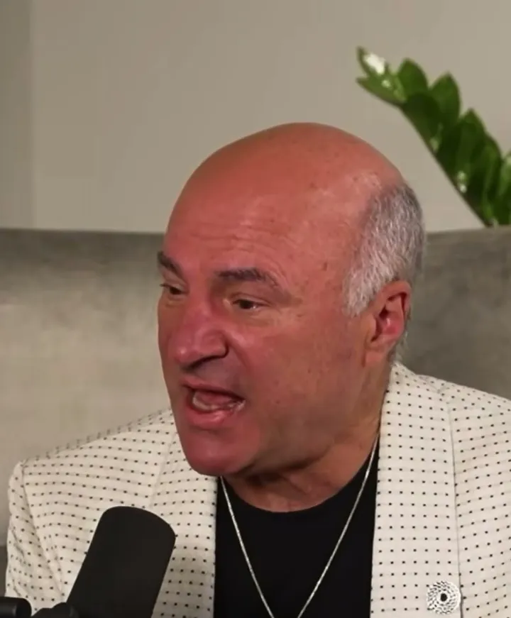 Kevin O'Leary short-form post: a bald man in a white blazer speaking passionately at a microphone.