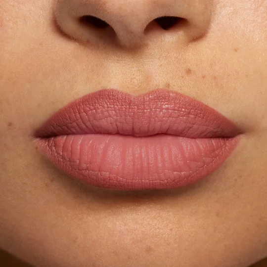 Kylie Cosmetics short-form post: a close-up of lips in a matte rosy-nude shade.