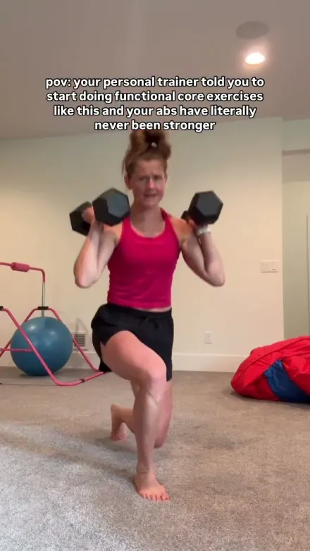 Nourish Move Love short-form post: a woman in a pink top holding two dumbbells in a lunge in a bright home gym.