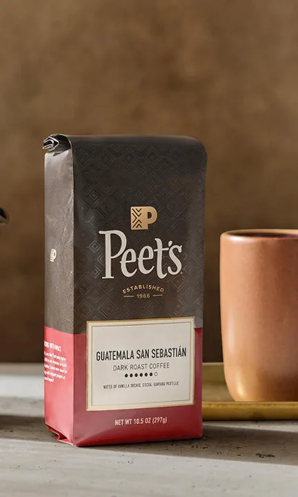 Peet's Coffee short-form post: a bag of Peet's Guatemala San Sebastian dark roast beside a terracotta mug on a table.