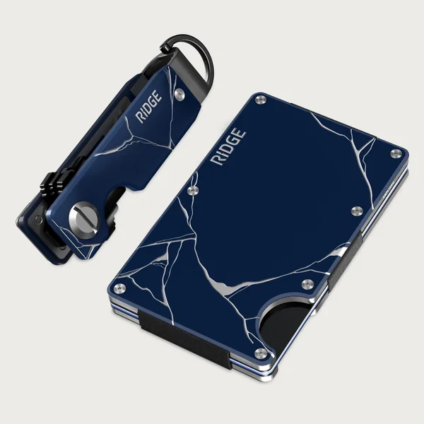 Ridge short-form post: a navy Kintsugi Ridge wallet and key case with gold-veined patterns on a pale grey background.