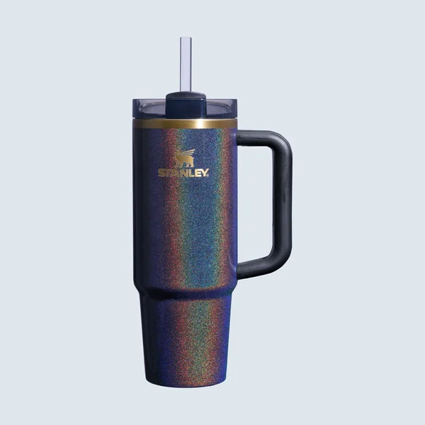 Stanley short-form post: a shimmering dark Quencher FlowState tumbler with a handle and a straw on a pale blue background.