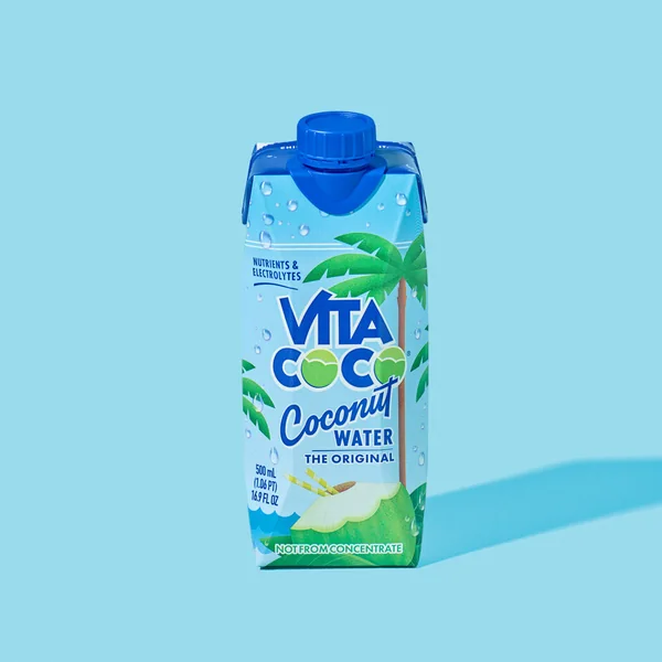 Vita Coco short-form post: a Coconut Water carton casting a long shadow on a light blue background.